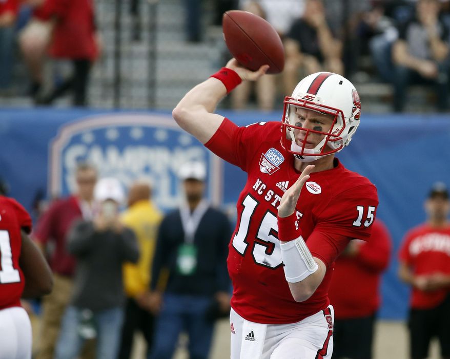 North Carolina State quarterback Ryan Finley (15) passes against Vanderbilt the first half of the Camping World Independence Bowl NCAA college football game in Shreveport, La., Monday, Dec. 26, 2016. North Carolina State won 41-17. (AP Photo/Rogelio V. Solis)