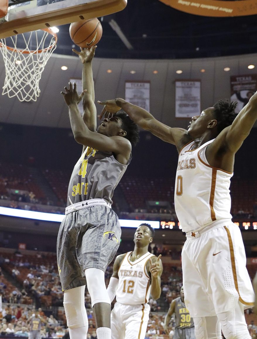 Kent State guard Taishaun Johnson (4) shoots past Texas guard Tevin Mack (0) during the first half of an NCAA college basketball game, Tuesday, Dec. 27, 2016, in Austin, Texas. (AP Photo/Eric Gay)