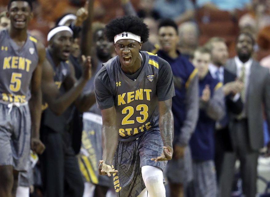 Kent State guard Jaylin Walker (23) celebrates a score against Texas during the second half of an NCAA college basketball game, Tuesday, Dec. 27, 2016, in Austin, Texas. Kent State won 63-58. (AP Photo/Eric Gay)