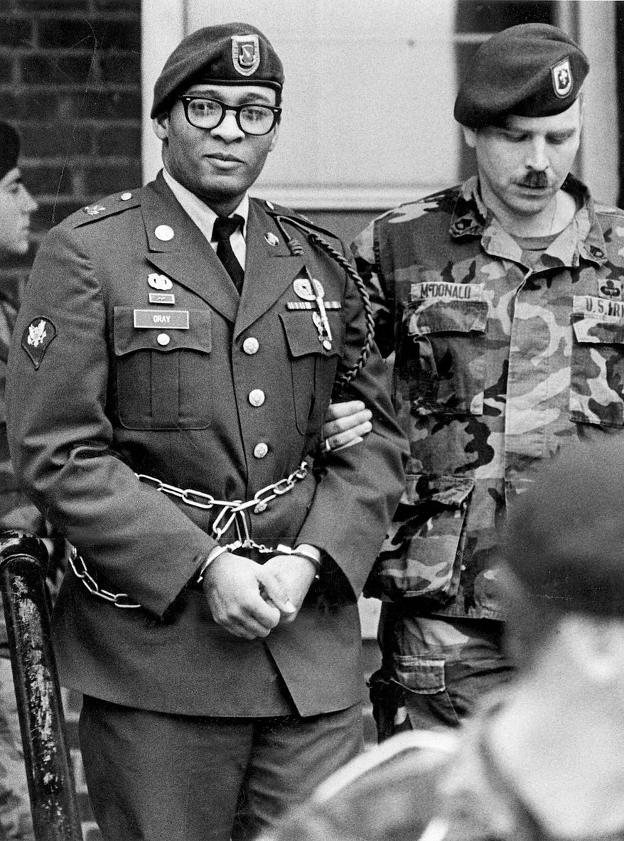 FILE - In this April 6, 1988, file photo, Ronald Gray leaves a courtroom escorted by military police at Fort Bragg, N.C. A Kansas federal judge has lifted a stay of execution for Gray, a former soldier who was sentenced to death for killing two women and a series of rapes, moving him closer to becoming the military's first death sentence carried out in more than a half century. No known execution date has been set for Gray as of Tuesday, Dec. 27, 2016. (Marcus Castro/The Fayetteville Observer via AP, File)