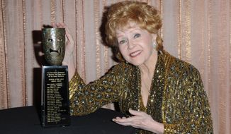 SAG Lifetime Achievement Award winner Debbie Reynolds is seen backstage at the 21st annual Screen Actors Guild Awards on Jan. 25, 2015, at the Shrine Auditorium in Los Angeles. (Associated Press)