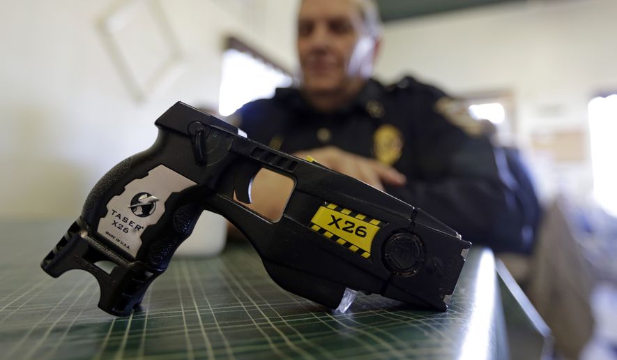 People who have gone to court to seek the right to carry stun guns — like this Taser X26 — say they would prefer having a nonlethal weapon for self-defense rather than a firearm but have cited Second Amendment protections in defending their right to do so. (Associated Press)