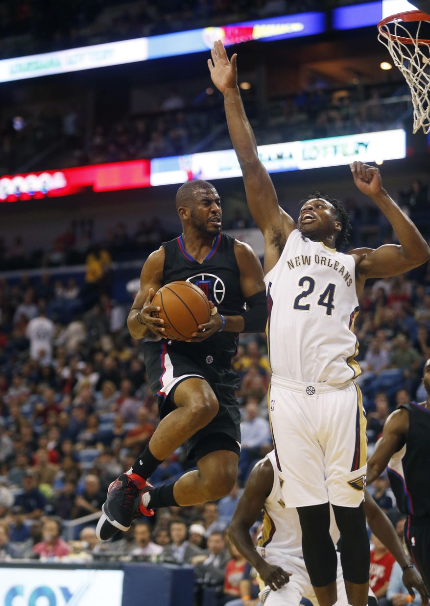 Los Angeles Clippers guard Chris Paul drives to the basket against New Orleans Pelicans guard Buddy Hield (24) during the first half of an NBA basketball game in New Orleans, Wednesday, Dec. 28, 2016. (AP Photo/Gerald Herbert)