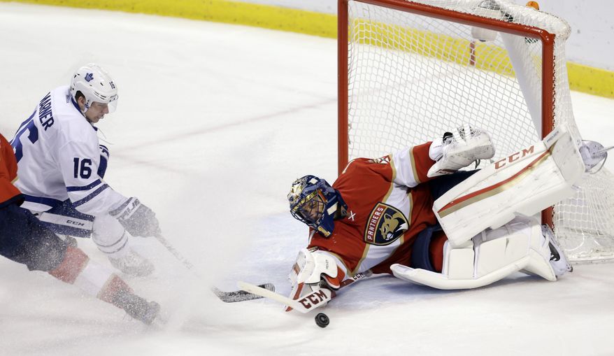 Florida Panthers goalie Roberto Luongo blocks a shot by Toronto Maple Leafs center Mitchell Marner (16) during the first period of an NHL hockey game, Wednesday, Dec. 28, 2016, in Sunrise, Fla. (AP Photo/Alan Diaz)