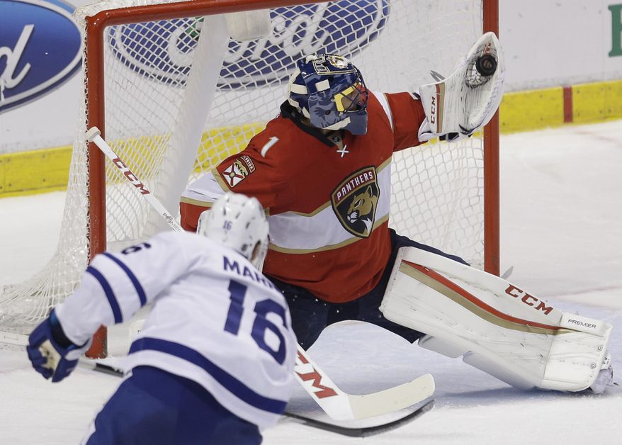 Florida Panthers goalie Roberto Luongo (1) blocks a shot by Toronto Maple Leafs center Mitchell Marner (16) during the second period of an NHL hockey game, Wednesday, Dec. 28, 2016, in Sunrise, Fla. (AP Photo/Alan Diaz)