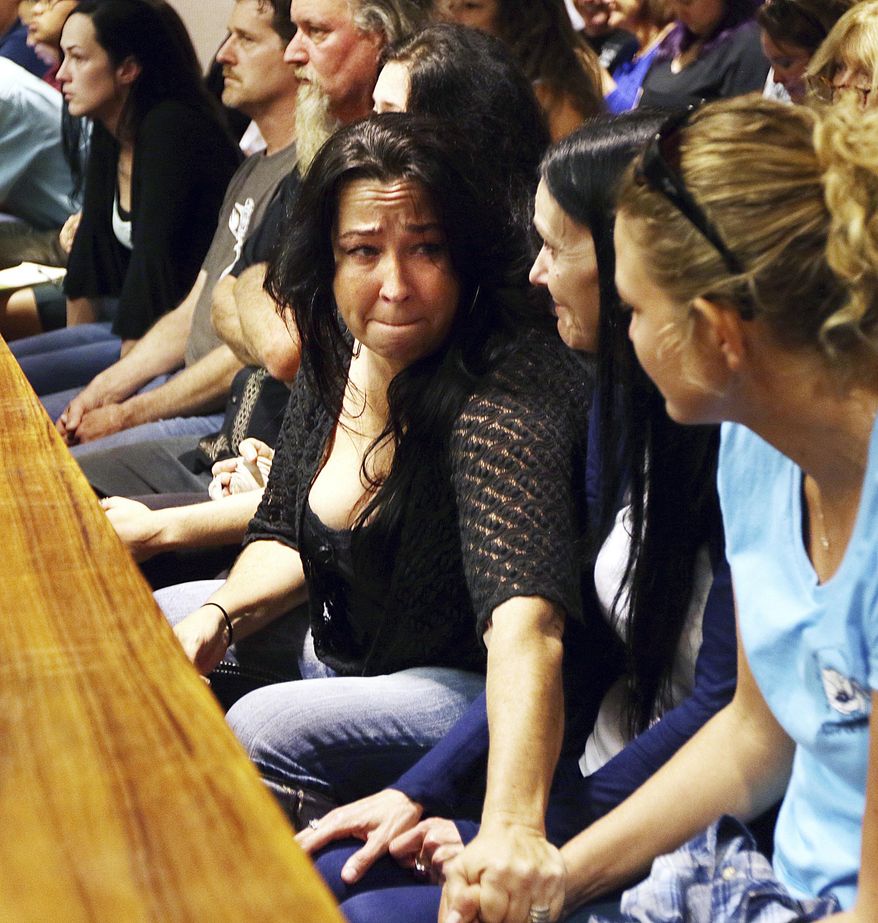 Kimberlyn Scott reacts to the verdicts finding Steven Capobianco guilty of murder and arson for the 2014 death of Scott's daughter Carly "Charli" Scott, Wednesday, Dec. 28, 2016, in Wailuku, Hawaii. Carly was five months pregnant with Capobianco's child and was last seen on Feb. 9. 2014. (Chris Sugidono/The News via AP)
