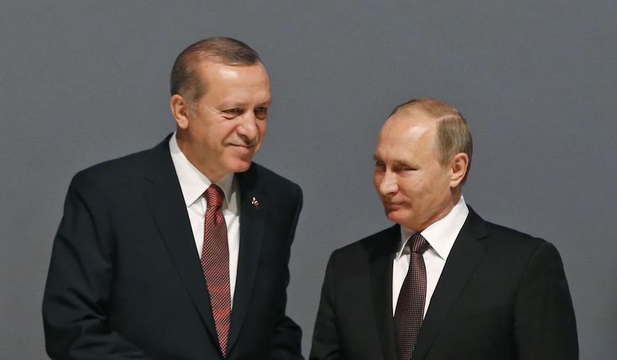 In this Oct. 10, 2016, file photo, Turkey&#x27;s President Recep Tayyip Erdogan, left and Russian President Vladimir Putin, shake hands following the group photo at the World Energy Congress, in Istanbul, Turkey. (AP Photo/Emrah Gurel, File)