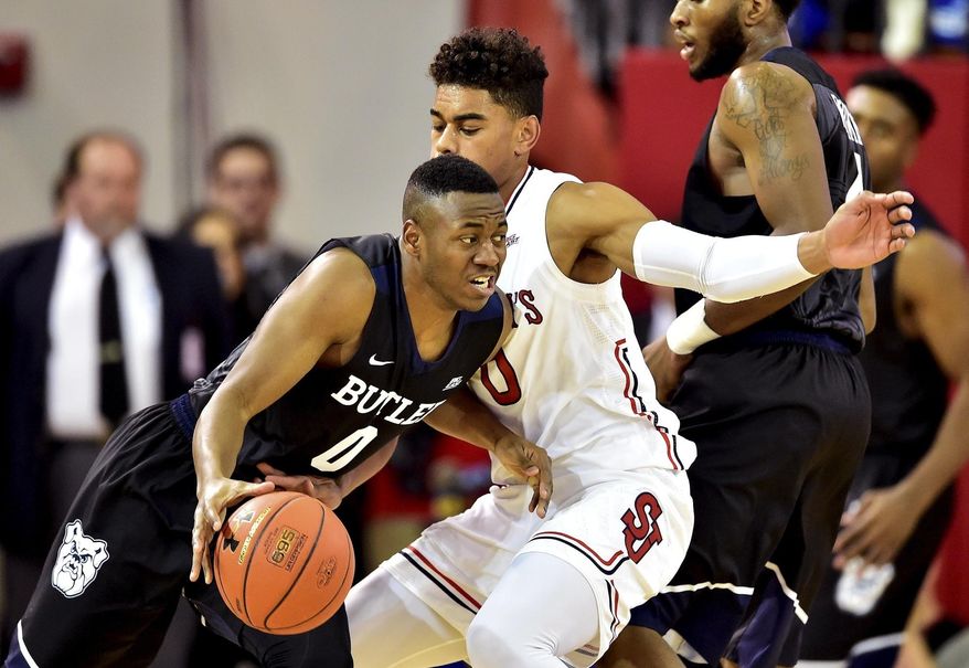 Butler'sAvery Woodson, left, is defended by St. John's Malik Ellison during an NCAA college basketball game in New York, Thursday, Dec. 29, 2016. (Steven Ryan/Newsday via AP)