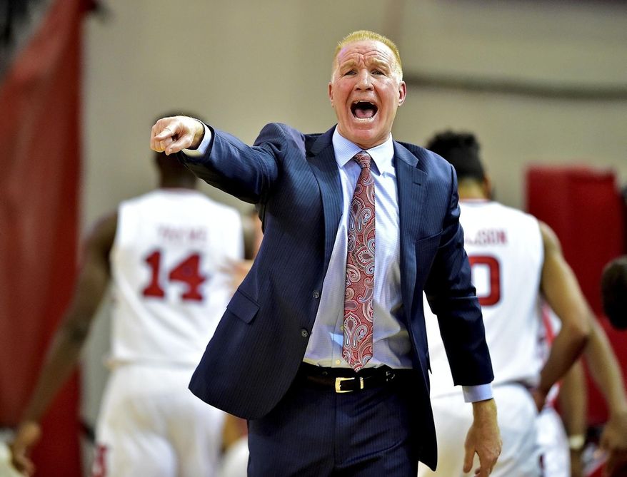 St. John's head coach Chris Mullin instructs his team against Butler during an NCAA college basketball game in New York, Thursday, Dec. 29, 2016. (Steven Ryan/Newsday via AP)
