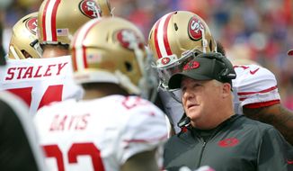 FILE - In a Sunday, Oct. 16, 2016 filel photo, San Francisco 49ers head coach Chip Kelly talks to his players during the first half of an NFL football game against the Buffalo Bills, in Orchard Park, N.Y. San Francisco snapped a franchise-record 13-game losing streak by winning 22-21 last week in Los Angeles and need another win on Jan. 1 to avoid tying the franchise record for losses in a season reached in 1978, &#x27;79 and 2004.(AP Photo/Bill Wippert, File)