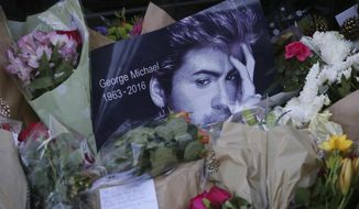 FILE - This Monday, Dec. 26, 2016 file photo shows tributes left outside the home of British musician George Michael in London. Michael, who rocketed to stardom with WHAM! and went on to enjoy a long and celebrated solo career lined with controversies, has died, his publicist said Sunday. He was 53. With the loss of several icons of Generation X’s youth, the year 2016 has left the generation born between the early 1960s and the early 1980s, wallowing in memories and contemplating its own mortality. (AP Photo/Tim Ireland)