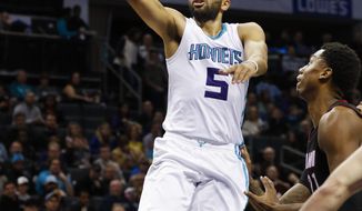 Charlotte Hornets guard Nicolas Batum, of France, drives to the basket against the Miami Heat during the first half of an NBA basketball game in Charlotte, N.C., Thursday, Dec. 29, 2016. (AP Photo/Nell Redmond)
