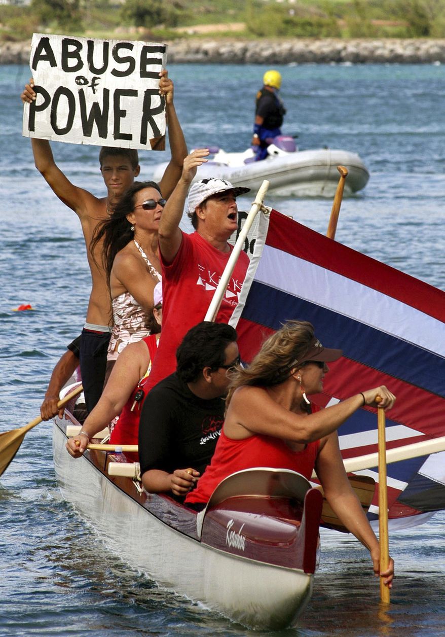 FILE - In this Dec. 15, 2007, file photo, a group of people ride in a canoe near the ferry arrival area during a protest against the Alakai Superferry in Maui, Hawaii. Hawaii officials are exploring what it would take to run a ferry between islands. But they're facing skepticism over costs and whether there's a ferry system residents would accept. But the idea is bringing back memories of the Superferry, an emotional and expensive failure in Hawaii history. Years ago protesters blocked the Superferry from docking in Kauai. And a court later ordered the ferry to stop running because the state didn't do a proper environmental review. (AP Photo/Agustin Tabares, File)