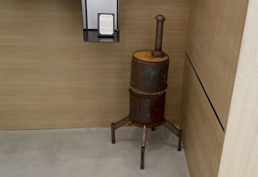 A meat smoker is displayed at the Museum of Broken Relationships Wednesday, Dec. 28, 2016, in Los Angeles. After her husband asked for a divorce, Amber Clisura gave back her engagement ring, kicked him out of the house and tossed everything that reminded her of the ruined marriage. Except for one item: a polished steel barbecue smoker that her future ex-husband had fashioned for her from an old oil drum. (AP Photo/Chris Carlson)