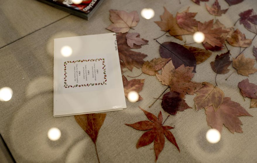 An envelope of leaves mailed from Canada to San Diego so a long-distance paramour could experience changing seasons in Southern California is displayed at the Los Angeles branch of the Museum of Broken Relationships Wednesday, Dec. 28, 2016 in Los Angeles. The Museum of Broken Relationships displays artifacts from failed unions, most of them mundane under ordinary circumstances. (AP Photo/Chris Carlson)