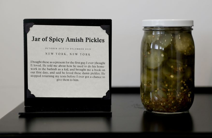 A jar of pickles purchased for a first love is displayed at the new Museum of Broken Relationships Wednesday, Dec. 28, 2016 in Los Angeles. The Museum of Broken Relationships displays artifacts from failed unions, most of them mundane under ordinary circumstances. (AP Photo/Chris Carlson)