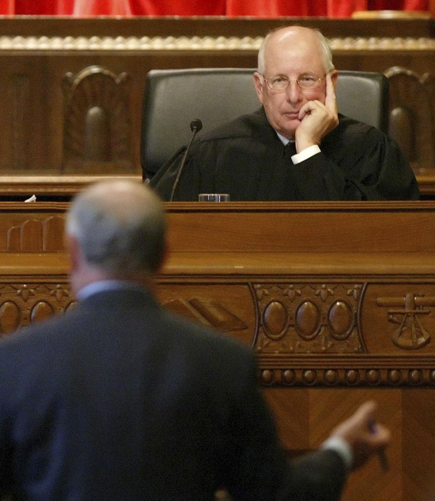 FILE - In this Nov. 29, 2005, file photo, Justice Paul Pfeifer listens to Attorney Donald Mooney present arguments in the Ohio Supreme Court in Columbus, Ohio. Pfeifer and fellow Ohio Supreme Court Justice Judith Ann Lanzinger are retiring at the end of 2016 due to mandatory age limits. (AP Photo/Will Shilling, File)