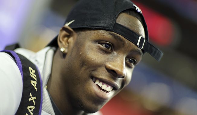 Washington's John Ross answers a question during media day for Saturday's Peach Bowl NCAA college football game against Alabama in Atlanta, Thursday, Dec. 29, 2016. (AP Photo/David Goldman)