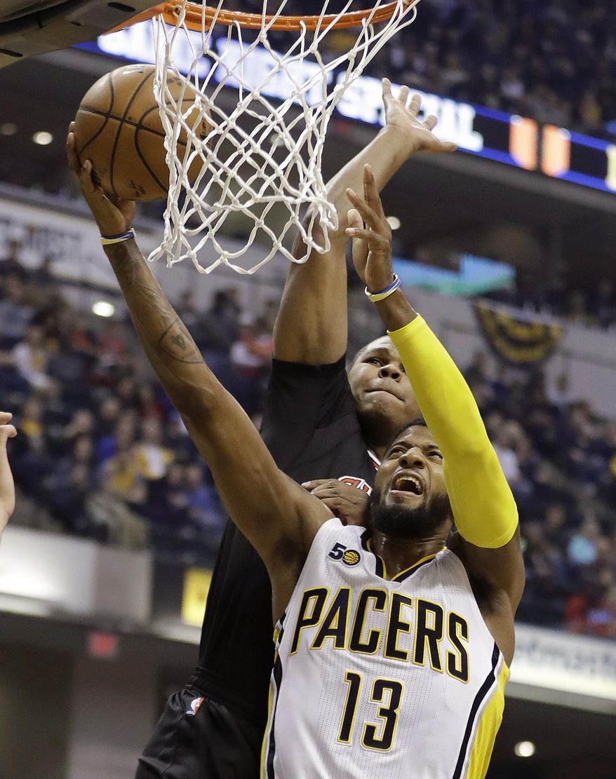 Indiana Pacers' Paul George shoots against Chicago Bulls' Cristiano Felicio during the first half of an NBA basketball game Friday, Dec. 30, 2016, in Indianapolis. (AP Photo/Darron Cummings)