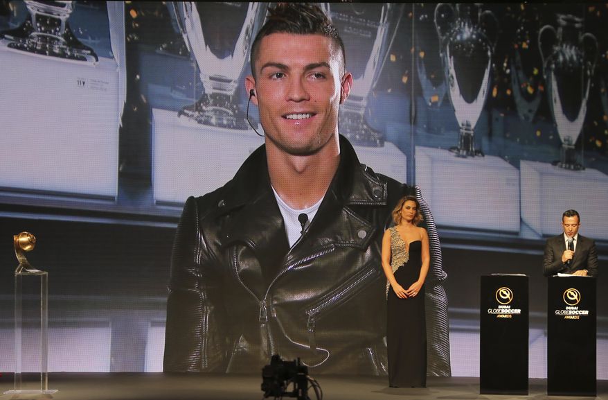 Cristiano Ronaldo speaks, via a video link live from Madrid after he was selected as the Best Player of the Year, during Dubai Football Gala & Globe Soccer Awards Ceremony in Dubai, United Arab Emirates, Tuesday, Dec. 27, 2016. (AP Photo/Kamran Jebreili)