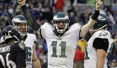 In a Sunday, Dec. 18, 2016 file photo, Philadelphia Eagles quarterback Carson Wentz (11) celebrates his touchdown during the second half of an NFL football game against the Baltimore Ravens in Baltimore. (AP Photo/Patrick Semansky, File)