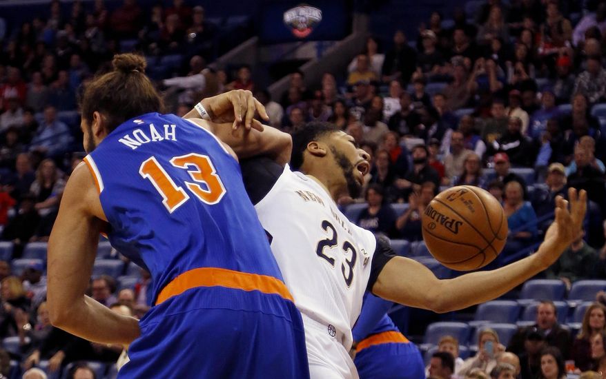 New Orleans Pelicans forward Anthony Davis (23) gets tangled up with New York Knicks center Joakim Noah (13) during a rebound in the first half of an NBA basketball game in New Orleans, Friday, Dec. 30, 2016. (AP Photo/Max Becherer)