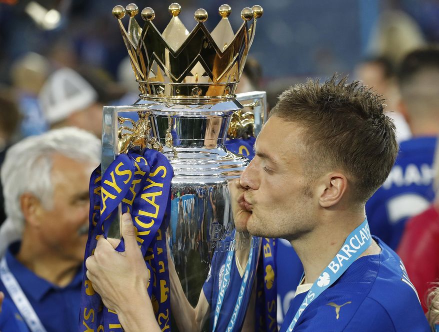 FILE - In this May 7, 2006, file photo, Leicester&#x27;s Jamie Vardy kisses the trophy as Leicester City celebrates becoming the English Premier League soccer champions at King Power stadium in Leicester, England. From the goat that enjoyed a long, successful run cursing the Cubs to those who bet on Leicester to win the Premier League, it’s been a year to remember. (AP Photo/Matt Dunham, File)