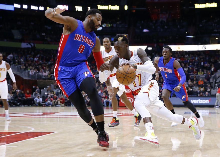 Atlanta Hawks guard Dennis Schroder (17) drives to the basket as Detroit Pistons center Andre Drummond (0) defends in the first half of an NBA basketball game on Friday, Dec. 30, 2016, in Atlanta. (AP Photo/Todd Kirkland)