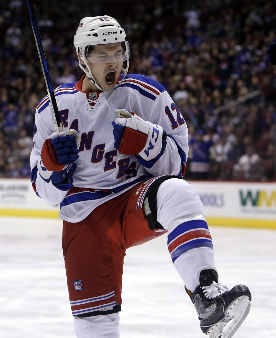 New York Rangers left wing Matt Puempel celebrates after scoring a first-period goal during an NHL hockey game against the Arizona Coyotes, Thursday, Dec. 29, 2016, in Glendale, Ariz. (AP Photo/Rick Scuteri)