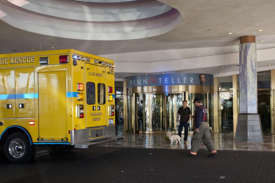 A Clark County firefighter walks past a guest standing outside the Ipanema Tower at the Rio Hotel & Casino after reports of smoke coming from the 21st floor of the Masquerade Tower led to guests being evacuated Thursday, Dec. 29, 2016. The Rio casino in Las Vegas scrambled to find alternate lodging for guests Thursday after a power outage led to the evacuation of 900 rooms just before the busy New Year’s Eve weekend, officials said. Nobody was injured, but emergency responders helped some guests with disabilities get to the bottom of the tower. (Yasmina Chavez/Las Vegas Sun via AP)