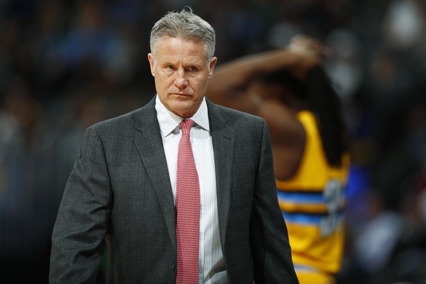 Philadelphia 76ers head coach Brett Brown looks to his bench for a substitution while facing the Denver Nuggets in the first half of an NBA basketball game Friday, Dec. 30, 2016, in Denver. (AP Photo/David Zalubowski)
