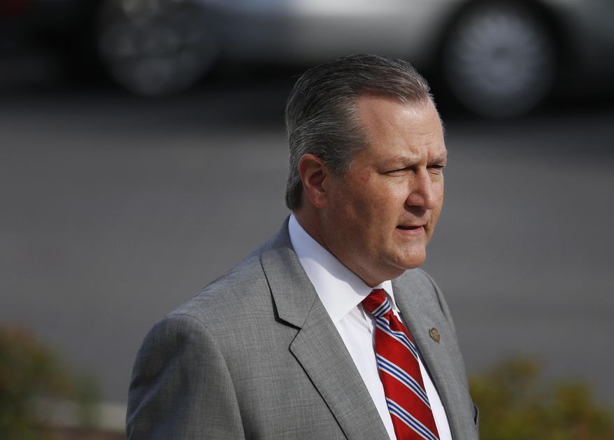 FILE - In this May 16, 2016, file photo, Rep. Mike Hubbard of Auburn, Ala., walks into the Lee County Justice Center during jury selection for the indicted Alabama speaker of the House in Opelika, Ala. It was a tremendous fall for the Republican politician who in 2010 led the GOP to their first legislative majority since Reconstruction and was expected to be a contender for higher office. A judge sentenced Hubbard to four years in prison. He remains free on bond as he appeals his conviction. (AP Photo/Brynn Anderson, File)