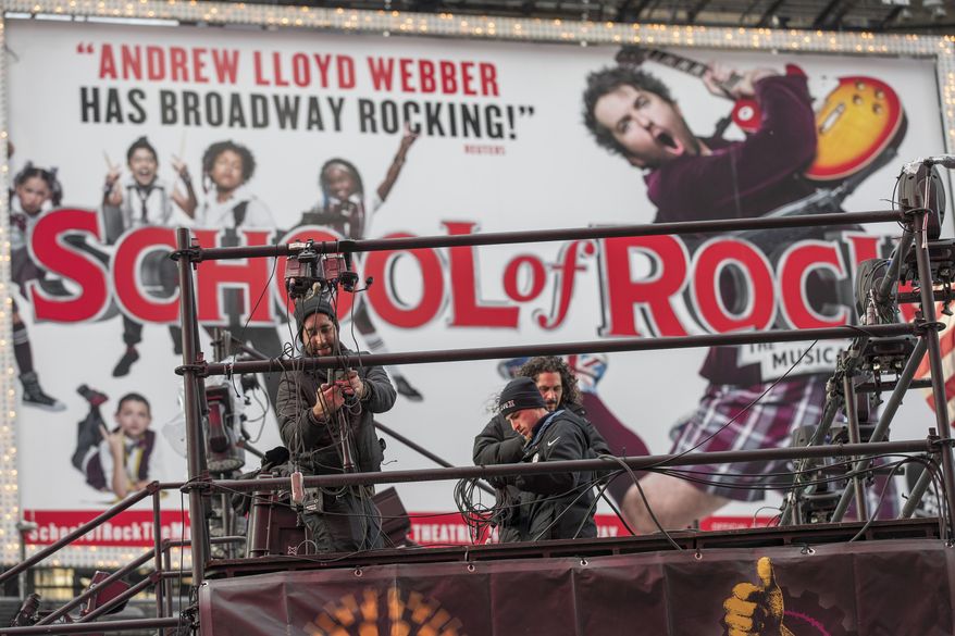 Technicians prepare a stage that will be used in the New Years celebration, Friday, Dec. 30, 2016, in New York's Times Square. (AP Photo/Mary Altaffer)