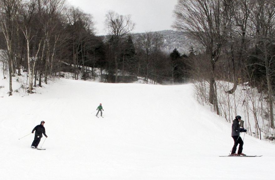 In this Dec. 30, 2016 photo, skiers descend a slope at Mad River Glen in Fayston, Vt. Ski areas are relishing in new snow a day after a powerful storm dumped 20 inches of snow in parts of Maine, and lesser amounts in other areas. Mad River received 6-8 inches. (AP Photo/Lisa Rathke)