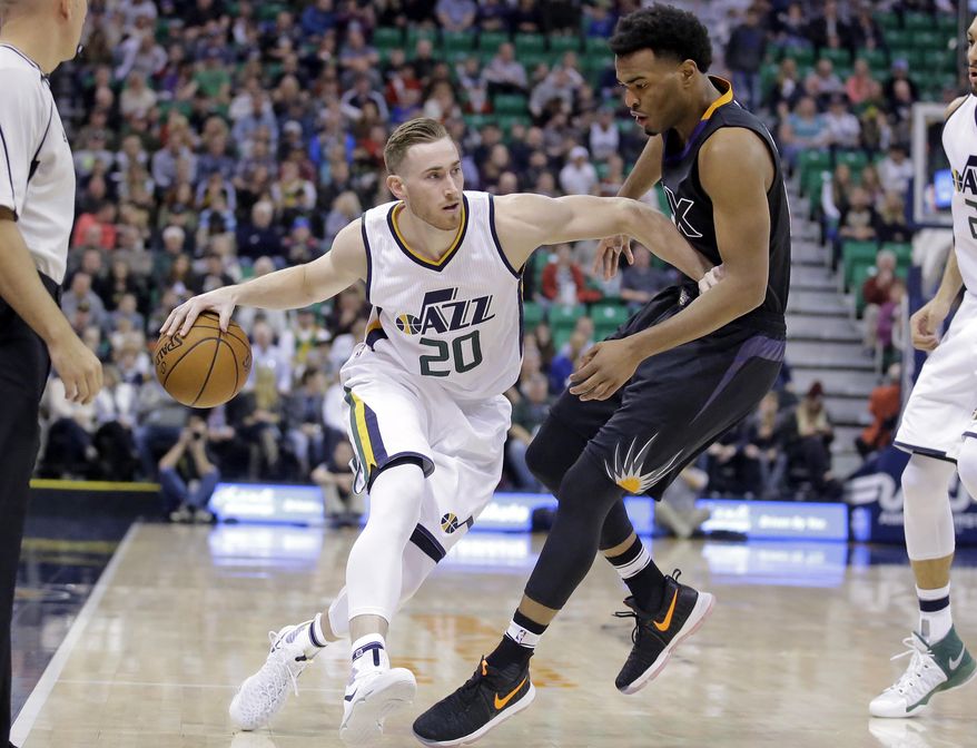 Phoenix Suns forward TJ Warren, right, guards Utah Jazz forward Gordon Hayward (20) in the first half during an NBA basketball game Saturday, Dec. 31, 2016, in Salt Lake City. (AP Photo/Rick Bowmer)