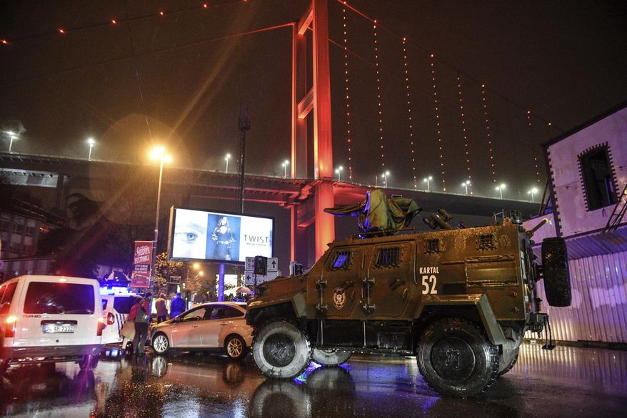 A police armoured vehicle blocks the road leading to the scene of an attack in Istanbul, early Sunday, Jan. 1, 2017. Private NTV television said more than one assailant may have been involved in the attack. The attacker or attackers are believed to have entered the nightclub in Istanbul&#39;s Ortakoy district disguised as Santa Claus, the station reported. (AP Photo)