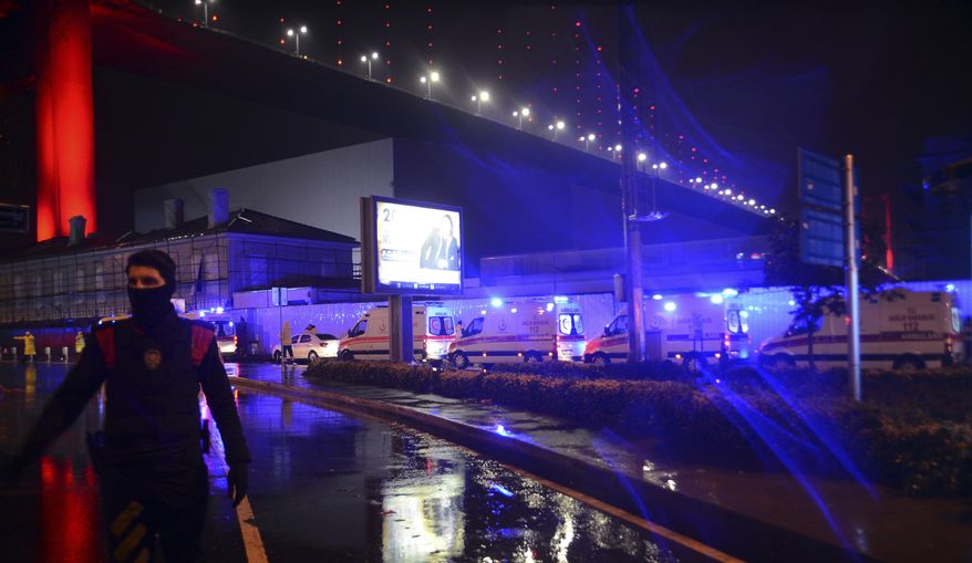 Medics and security officials work at the scene after an attack at a popular nightclub in Istanbul, early Sunday, Jan. 1, 2017. Turkey&#39;s state-run news agency says an armed assailant has opened fire at a nightclub in Istanbul during New Year&#39;s celebrations, wounding several people.(IHA via AP)