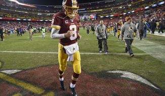 Washington Redskins quarterback Kirk Cousins (8) runs off the field after an NFL football game against the New York Giants in Landover, Md., Sunday, Jan. 1, 2017. The New York Giants defeated the Washington Redskins 19-10. (AP Photo/Nick Wass)