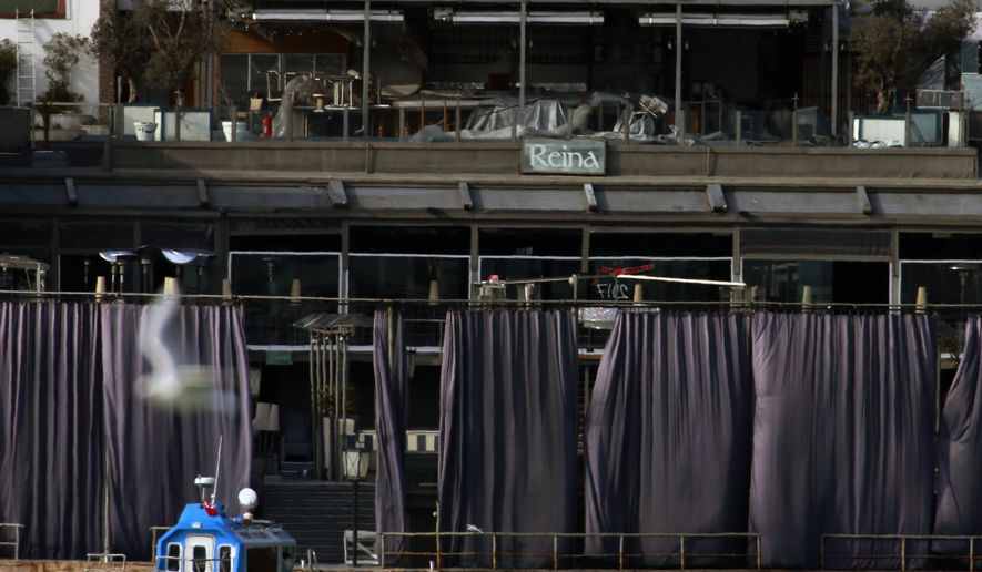 A view of a nightclub by the Bosphorus, which was attacked by a gunman overnight, in Istanbul, on New Year's Day, Sunday, Jan 1, 2017. An assailant believed to have been dressed in a Santa Claus costume and armed with a long-barrelled weapon, opened fire at the nightclub in Istanbul's Ortakoy district during New Year's celebrations, killing dozens of people and wounding dozens of others in what the province's governor described as a terror attack. (AP Photo/Emrah Gurel)