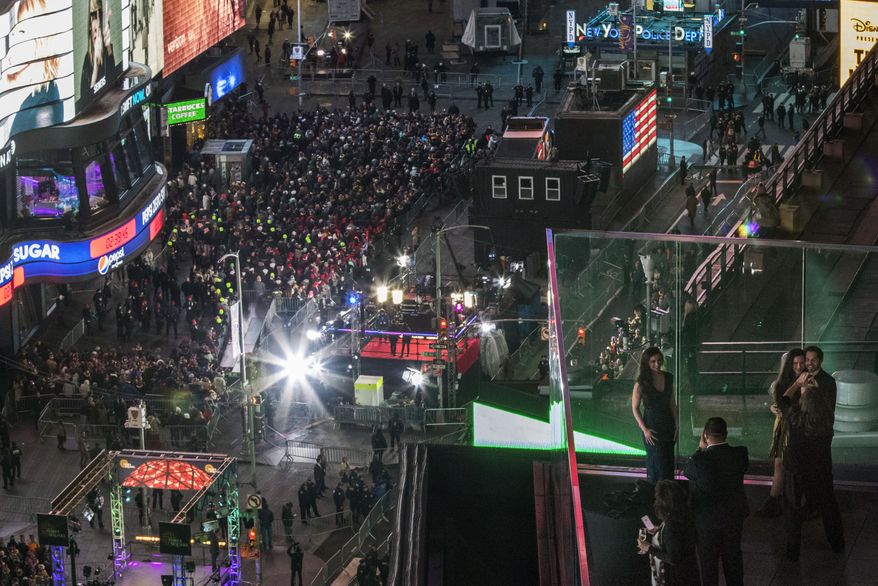 Revelers take part in the New Year's Eve celebration in New York's Times Square as seen from the Marriott Marquis, Saturday, Dec. 31, 2016. (AP Photo/Mary Altaffer)