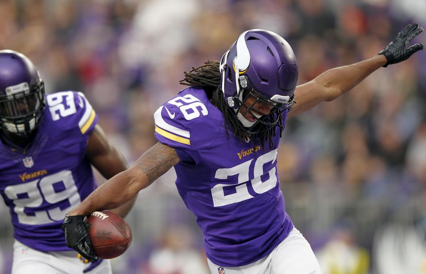 Minnesota Vikings cornerback Trae Waynes (26) celebrates after intercepting a pass during the second half of an NFL football game against the Chicago Bears, Sunday, Jan. 1, 2017, in Minneapolis. (AP Photo/Andy Clayton-King)