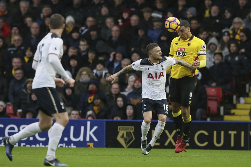 Watford's Troy Deeney, right, competes for the ball with Tottenham's Kieran Trippier during the English Premier League soccer match between Watford and Tottenham Hotspur at the Vicarage Road Stadium in Watford, Sunday Jan. 1, 2017. (AP Photo/Tim Ireland)