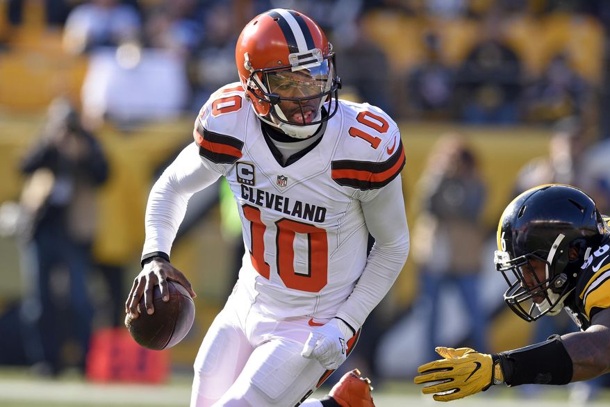 Cleveland Browns quarterback Robert Griffin III (10) rolls out under pressure by Pittsburgh Steelers defensive tackle L.T. Walton (96) during the first half of an NFL football game in Pittsburgh, Sunday, Jan. 1, 2017. (AP Photo/Don Wright)