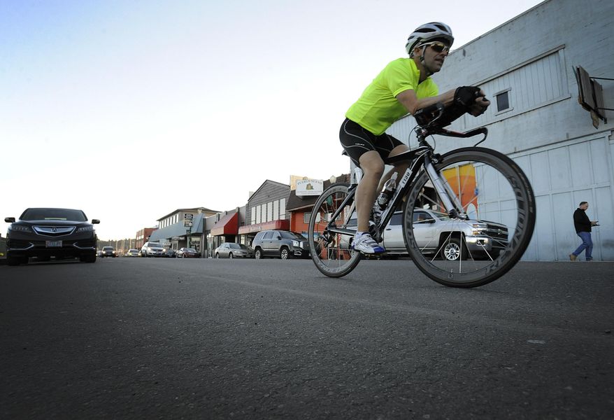 ADVANCE FOR THE WEEKEND OF DEC. 30-JAN 1 AND THEREAFTER - In a Dec. 21, 2016 photo, Robert Lounsbury, an Ironman triathlete, continues to train in Coos Bay for competitions after recovering from a bike accident left him with a concussion and several broken bones. (Bethany Baker/The World via AP)