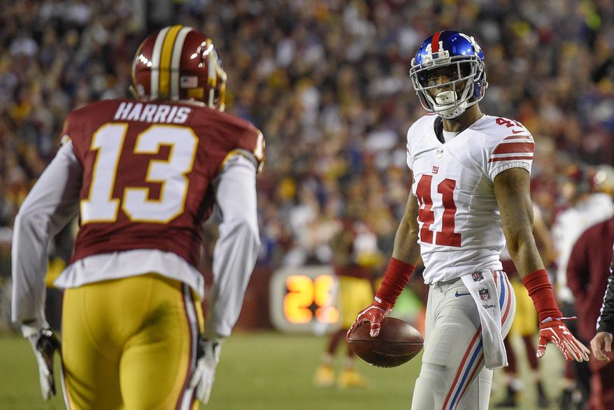 New York Giants cornerback Dominique Rodgers-Cromartie (41) looks at Washington Redskins wide receiver Maurice Harris (13) after intercepting a pass intended for Harris during the second half of an NFL football game in Landover, Md., Sunday, Jan. 1, 2017. (AP Photo/Nick Wass)