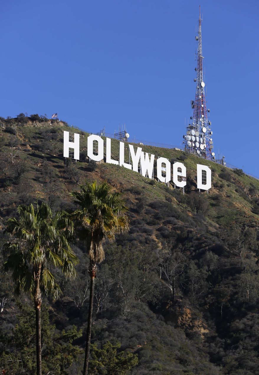 The Hollywood sign is seen vandalized Sunday, Jan. 1, 2017. Los Angeles residents awoke New Year's Day to find a prankster had altered the famed Hollywood sign to read "HOLLYWeeD." Police have notified the city's Department of General Services, whose officers patrol Griffith Park and the area of the rugged Hollywood Hills near the sign. California voters in November approved Proposition 64, which legalized the recreational use of marijuana, beginning in 2018. (AP Photo/Damian Dovarganes)