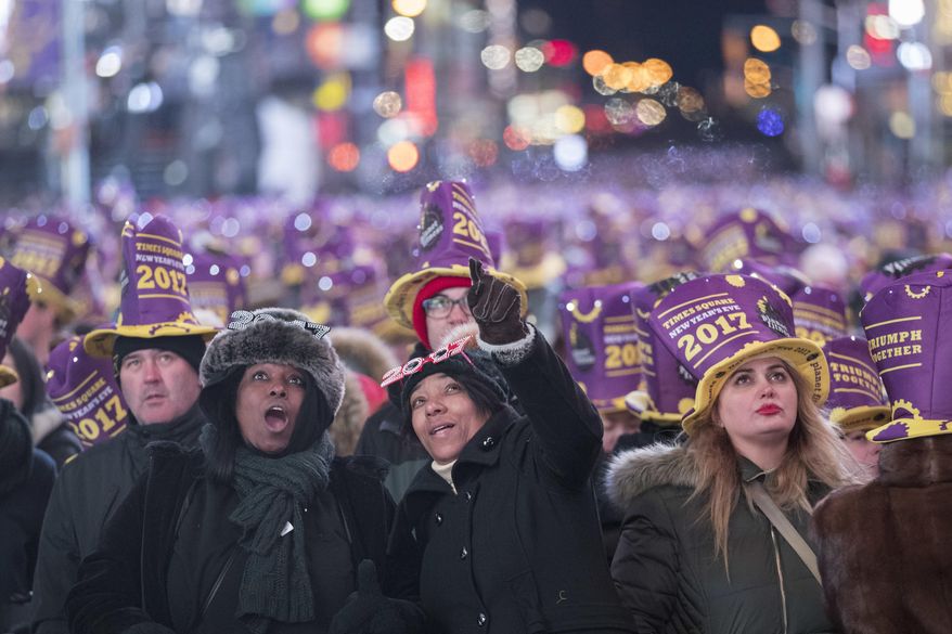 Revelers take part in the New Year's Eve celebration in New York's Times Square, Saturday, Dec. 31, 2016. (AP Photo/Mary Altaffer)