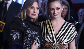 FILE- In this Dec. 14, 2015, file photo, Carrie Fisher, left, and daughter Billie Lourd arrive at the world premiere of &amp;quot;Star Wars: The Force Awakens&amp;quot; at the TCL Chinese Theatre in Los Angeles. Lourd says the support she’s received since the death of her mother and her grandmother, Debbie Reynolds, has given her strength. (Photo by Jordan Strauss/Invision/AP, File)