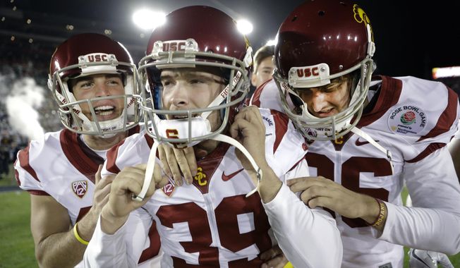 Southern California place kicker Matt Boermeester, middle, celebrates after the game winning field goal against Penn State during the second half of the Rose Bowl NCAA college football game Monday, Jan. 2, 2017, in Pasadena, Calif. (AP Photo/Jae C. Hong) ** FILE **