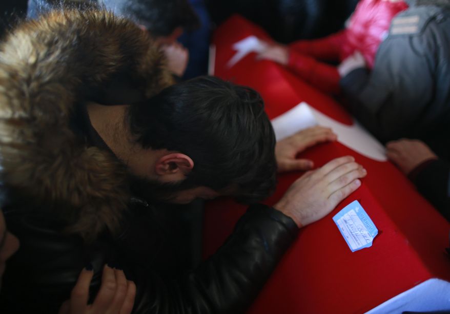 A mourner cries over the Turkish flag-draped coffin of Yunus Gormek, 23, one of the victims of the attack at a nightclub on New Year&#39;s Day, during the funeral in Istanbul, Monday, Jan. 2, 2017.  An assailant armed with a long-barrelled weapon, opened fire at the nightclub in Istanbul&#39;s Ortakoy district during New Year&#39;s celebrations, killing dozens of people and wounding many others.  (AP Photo/Emrah Gurel)